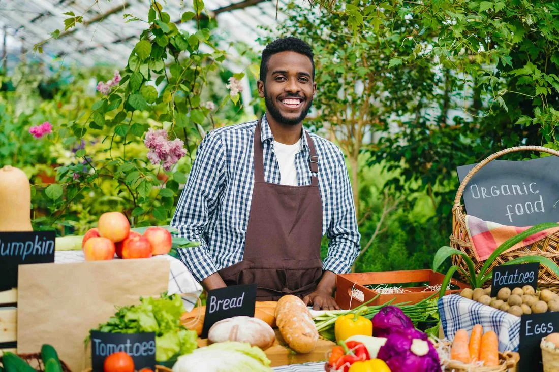 Producer presenting fresh food to customers